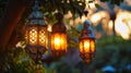 Three lanterns hanging from a tree in the evening Royalty Free Stock Photo