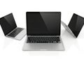 Three laptops arranged in a row isolated on white background Royalty Free Stock Photo