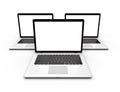 Three laptops with blank white screens isolated. Mockup laptop. Royalty Free Stock Photo