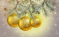 Three large Christmas balls in the snow close-up on fir branches. Beautiful card for the New Year