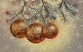 Three large Christmas vintage balls in the snow close-up on fir branches. Beautiful vintage card for the New Year