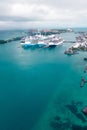 three large cruise ships docked in the ocean, one smaller, in the foreground Royalty Free Stock Photo