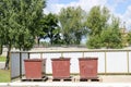 Three large industrial brown dustbin, trash for separate garbage collection in an industrial plant