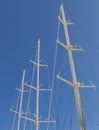 Ship`s Masts. Blue sky in the background. Royalty Free Stock Photo