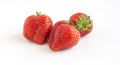 Three large red ripe strawberries on white background Royalty Free Stock Photo