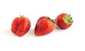 Three large red ripe strawberries on white background Royalty Free Stock Photo