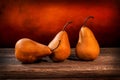 Three large yellow bosc pears on a barn wood table Royalty Free Stock Photo