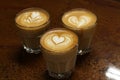 Latte art coffee Rosetta, heart, and tulip Royalty Free Stock Photo