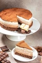 Three layered chocolate mousse cake on a light background. vertical image. top view. place for text Royalty Free Stock Photo