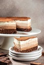 Three layered chocolate mousse cake on a light background. vertical image. top view. place for text Royalty Free Stock Photo