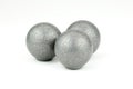 Three lead musket balls on white background