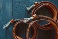 Three leather brown belts on dark background