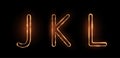 Three letters JKL drawn with a fiery line with sparks on a dark background. Very realistic illustration