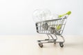 Three light bulb on the shopping cart Royalty Free Stock Photo