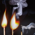 Three lighted matches Royalty Free Stock Photo
