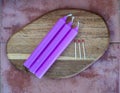 three lilac candles and three matches Royalty Free Stock Photo