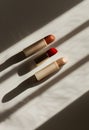 Three Lipsticks Aligned on Window Sill Royalty Free Stock Photo