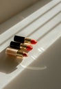 Three Lipsticks Aligned on Window Sill Royalty Free Stock Photo