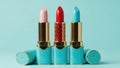 Three lipsticks in pink, red, and blue, isolated on white background Royalty Free Stock Photo