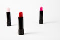 Three lipsticks on white background. Royalty Free Stock Photo
