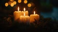 Three lit candles on a Christmas tree. Suitable for holiday concepts Royalty Free Stock Photo