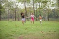 Three little children; Asian, African-American, Mix race happy running and playing outdoor Royalty Free Stock Photo