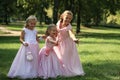 Three little cute bridesmaids with bubble