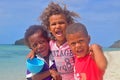 Three little Fijian kids from Yasawa Islands smiling with much excitement clearly visible from their candid scream of joy