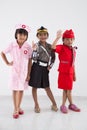 Three little girl in different profession uniform