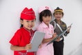 Three little girl in different profession uniform