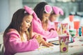 Three little girls having a party at home. Royalty Free Stock Photo