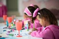 Three little girls having a party at home. Royalty Free Stock Photo