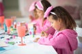 Three little girls having a party at home. K Royalty Free Stock Photo