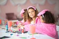Three little girls having a party at home. Royalty Free Stock Photo