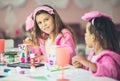 Three little girls having a party at home. Kids playing and drawing Royalty Free Stock Photo