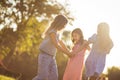 Three little girls playing in nature and holding hands. Little girls dancing Royalty Free Stock Photo