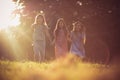 Three little girls playing together in nature. Royalty Free Stock Photo