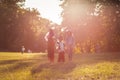 Three little girls standing in the park and wearing Halloween suits Royalty Free Stock Photo