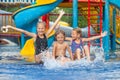 Three little kids playing in the swimming pool