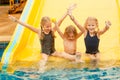 Three little kids playing in the swimming pool Royalty Free Stock Photo
