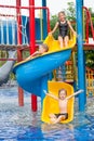 Three little kids playing in the swimming pool Royalty Free Stock Photo