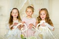 Three little princess standing on the bed Royalty Free Stock Photo