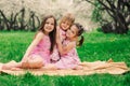 Three little sisters having a lot of fun playing together outdoor in summer park Royalty Free Stock Photo