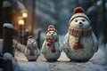 Three little snowmen in knitted caps and scarfs on snow in the winter