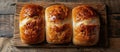 Three Loaves of Bread on Cutting Board Royalty Free Stock Photo