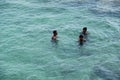 Three Local boys swimming in sea, Sri Lanka