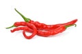 Three long curved red hot chili peppers