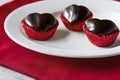 Three love shape chocolate served on the white plate Royalty Free Stock Photo
