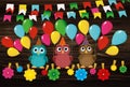 Three lovely owls sit on a rope and hold balloons. Hanging on cl Royalty Free Stock Photo