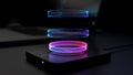 Futuristic Glowing Rings Hovering Over a Sleek Black Device Royalty Free Stock Photo